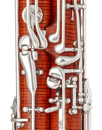 Double C spatula, whisper-key lock for the left thumb, rollers between C# key and whisper key for left thumb, adjusting screw on B<i>b</i> key and gliding roller on whisper-key mechanism